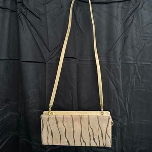 Vintage Valle Verde, tan suede with zebra style stripe in front of clutch bag.